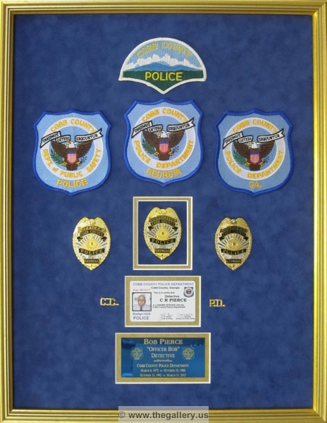 Cobb County Police Department retirement shadow box with police badges, patches, ID cards and lapel pins.






The Gallery at Brookwood
www.thegallery.us
770-941-3394
Your Custom Framing Expert
Picture Framing Examples
Custom Framing Examples
Shadowbox Examples
IMG_2348