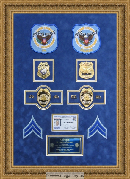 Cobb County Police Department retirement shadow box with police badges, patches, ID cards and lapel pins.






The Gallery at Brookwood
www.thegallery.us
770-941-3394
Your Custom Framing Expert
Picture Framing Examples
Custom Framing Examples
Shadowbox Examples
Police_Department_retirement_shadow_box_with_badges