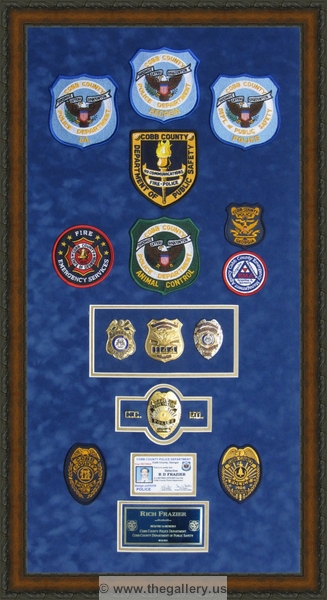 Police Department retirement shadow box with police badges, patches, ID cards and lapel pins.






The Gallery at Brookwood
www.thegallery.us
770-941-3394
Your Custom Framing Expert
Picture Framing Examples
Custom Framing Examples
Shadowbox Examples
Police_Department_retirement_shadow_box_with_badges_gift