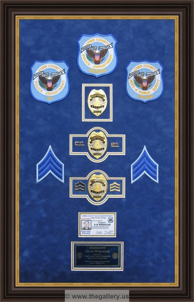 Police Department retirement shadow box with police badges, patches, ID cards and lapel pins.






The Gallery at Brookwood
www.thegallery.us
770-941-3394
Your Custom Framing Expert
Picture Framing Examples
Custom Framing Examples
Shadowbox Examples
Police_Department_retirement_shadow_box_with_badges_retirement