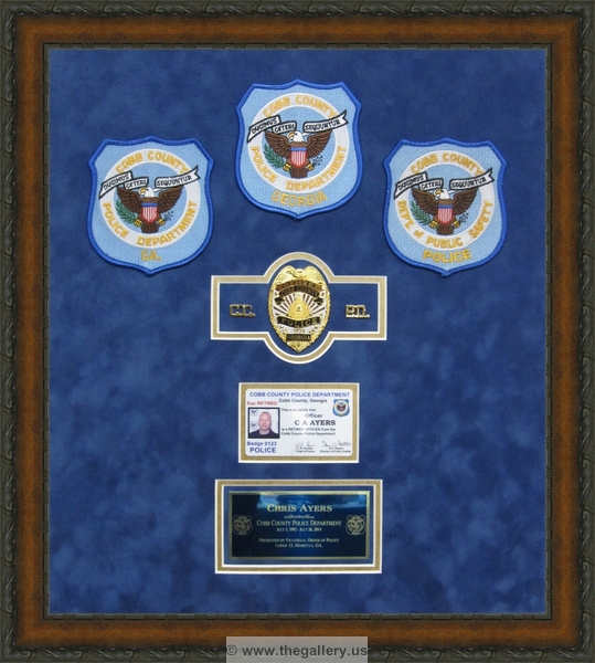 Police Department retirement shadow box with police badges, patches, ID cards and lapel pins.






The Gallery at Brookwood
www.thegallery.us
770-941-3394
Your Custom Framing Expert
Picture Framing Examples
Custom Framing Examples
Shadowbox Examples
Police_retirement_shadow_box_with_badges