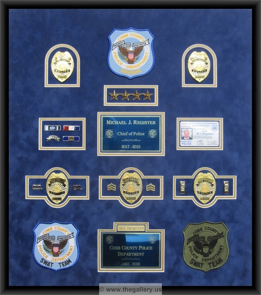 


military shadow box with flag, 



The Gallery at Brookwood
www.thegallery.us
770-941-3394
Your Custom Framing Expert
Picture Framing Examples
Custom Framing Examples
Shadowbox Examples
cobb-county-police-department