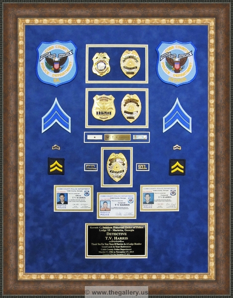 Police Department retirement shadow box with police badges, patches, ID cards and lapel pins.






The Gallery at Brookwood
www.thegallery.us
770-941-3394
Your Custom Framing Expert
Picture Framing Examples
Custom Framing Examples
Shadowbox Examples
cobb_county_police_retirement