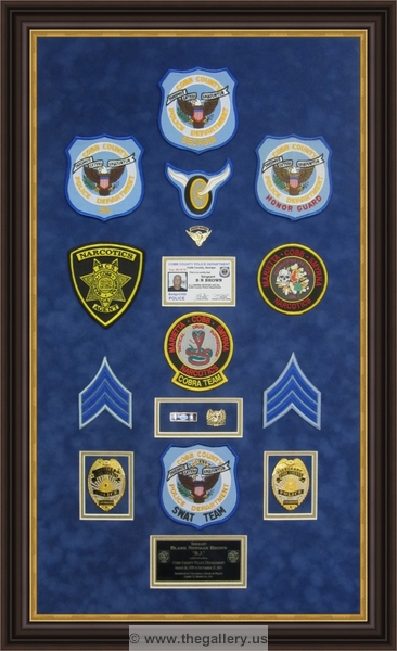 Police Department retirement shadow box with police badges, patches, ID cards and lapel pins.






The Gallery at Brookwood
www.thegallery.us
770-941-3394
Your Custom Framing Expert
Picture Framing Examples
Custom Framing Examples
Shadowbox Examples
cobb_county_police_retirement_gift