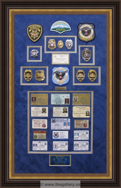 Cobb County Police Department retirement shadow box with police badges, patches, ID cards and lapel pins.






The Gallery at Brookwood
www.thegallery.us
770-941-3394
Your Custom Framing Expert
Picture Framing Examples
Custom Framing Examples
Shadowbox Examples
police_shadow_box