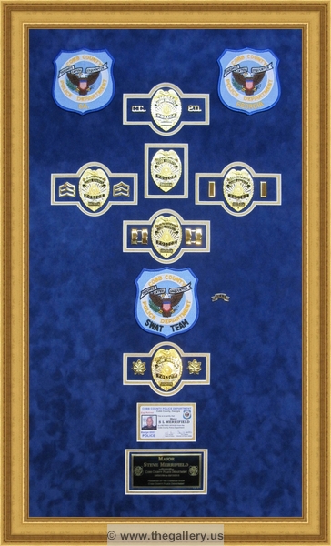 Cobb County Police Department retirement shadow box with police badges, patches, ID cards and lapel pins.






The Gallery at Brookwood
www.thegallery.us
770-941-3394
Your Custom Framing Expert
Picture Framing Examples
Custom Framing Examples
Shadowbox Examples
texture4_20790462_7