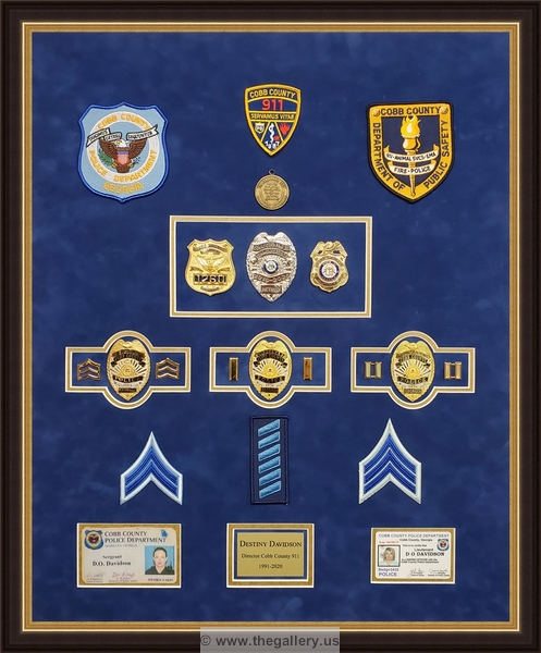  Police Department retirement shadowbox with police badges, patches, ID cards and lapel pins.


military shadow box with flag, 



The Gallery at Brookwood
www.thegallery.us
770-941-3394
Your Custom Framing Expert
Picture Framing Examples
Custom Framing Examples
Shadowbox Examples
texture4_48762396_25