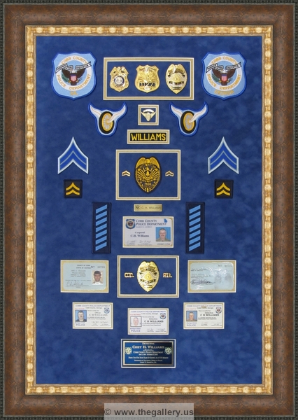 Cobb County Police Department retirement shadow box with police badges, patches, ID cards and lapel pins.


Police Department retirement shadow box examples



The Gallery at Brookwood
www.thegallery.us
770-941-3394
Your Custom Framing Expert
Picture Framing Examples
Custom Framing Examples
Shadowbox Examples
texture4_82320188_28
