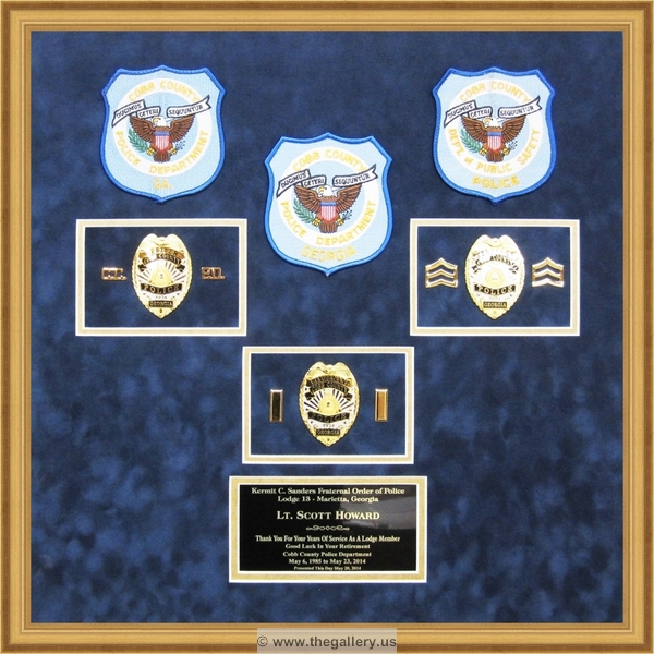 Cobb County Police Department retirement shadow box with police badges, patches, ID cards and lapel pins.






The Gallery at Brookwood
www.thegallery.us
770-941-3394
Your Custom Framing Expert
Picture Framing Examples
Custom Framing Examples
Shadowbox Examples
texture7_7791325_35