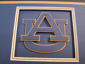 Detail view of Auburn University with the logo cut into the  mat.

The Gallery at Brookwood
www.thegallery.us
770-941-3394
Your Custom Framing Expert
Picture Framing Examples
Custom Framing Examples
Shadowbox Examples