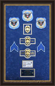 Police Department retirement shadow box with police badges, patches, ID cards and lapel pins.

The Gallery at Brookwood
www.thegallery.us
770-941-3394
Your Custom Framing Expert
Picture Framing Examples
Custom Framing Examples
Shadowbox Examples