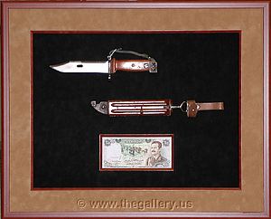 Shadowbox with Iraq knife and money.

The Gallery at Brookwood
www.thegallery.us
770-941-3394
Your Custom Framing Expert
Picture Framing Examples
Custom Framing Examples
Shadowbox Examples