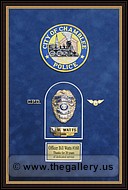  Police Department retirement shadow box with police badges, patches, ID cards and lapel pins.
Norcross_Picture_Hanger.jpg
