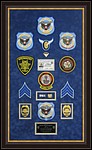 Police Department retirement shadow box
 with police badges, patches, ID cards and lapel pins.
Alpharetta_Frame_Shop.jpg