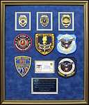 Cobb County Police Department retirement shadow
 box with police badges, patches, ID cards and lapel pins.
Decatur_Picture_Framer.jpg
