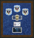 Police Department retirement shadow box
 with police badges, patches, ID cards and lapel pins.
kennesaw_picture_framer.jpg