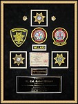 Police Department retirement shadow box with police badges, patches, ID cards and lapel pins.
norcross_mirror_framer.jpg