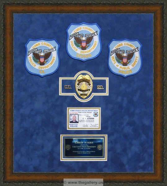 Police Department retirement shadow box with police badges, patches, ID cards and lapel pins.






The Gallery at Brookwood
www.thegallery.us
770-941-3394
Your Custom Framing Expert
Picture Framing Examples
Custom Framing Examples
Shadowbox Examples
Police_retirement_shadow_box_with_badges