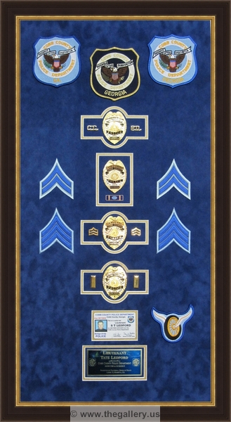 Cobb County Police Department retirement shadow box with police badges, patches, ID cards and lapel pins.


police shadow box ideas



The Gallery at Brookwood
www.thegallery.us
770-941-3394
Your Custom Framing Expert
Picture Framing Examples
Custom Framing Examples
Shadowbox Examples
police-department-shadow-box