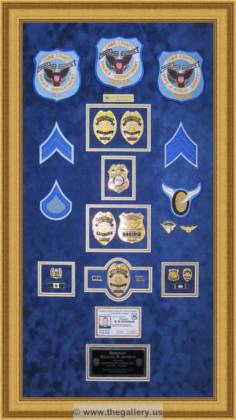  Police Department retirement shadow box with police badges, patches, ID cards and lapel pins.


Police Department retirement shadow box examples



The Gallery at Brookwood
www.thegallery.us
770-941-3394
Your Custom Framing Expert
Picture Framing Examples
Custom Framing Examples
Shadowbox Examples
police_shadow_box_georgia