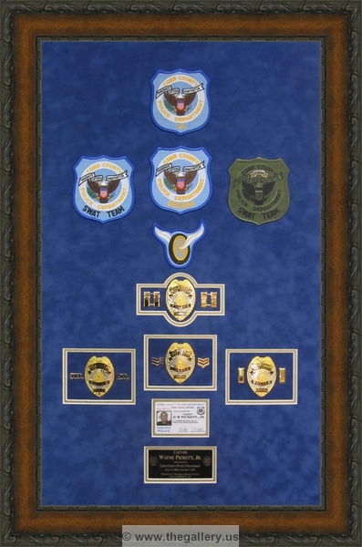 Cobb County Police Department retirement shadow box with police badges, patches, ID cards and lapel pins.






The Gallery at Brookwood
www.thegallery.us
770-941-3394
Your Custom Framing Expert
Picture Framing Examples
Custom Framing Examples
Shadowbox Examples
texture13_21669529_23
