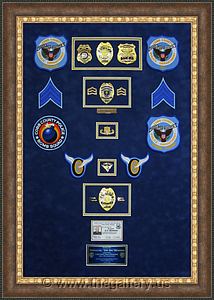 Cobb County Police Department retirement shadow box with police badges, patches, ID cards and lapel pins.

The Gallery at Brookwood
www.thegallery.us
770-941-3394
Your Custom Framing Expert
Picture Framing Examples
Custom Framing Examples
Shadowbox Examples
