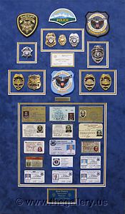 Cobb County Police Department retirement shadow box with police badges, patches, ID cards and lapel pins.

The Gallery at Brookwood
www.thegallery.us
770-941-3394
Your Custom Framing Expert
Picture Framing Examples
Custom Framing Examples
Shadowbox Examples
