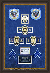 Cobb County Police Department retirement shadow box with police badges, patches, ID cards and lapel pins.

The Gallery at Brookwood
www.thegallery.us
770-941-3394
Your Custom Framing Expert
Picture Framing Examples
Custom Framing Examples
Shadowbox Examples