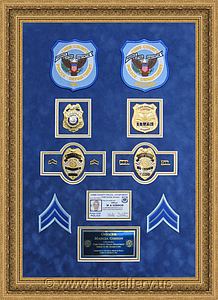 Cobb County Police Department retirement shadow box with police badges, patches, ID cards and lapel pins.

The Gallery at Brookwood
www.thegallery.us
770-941-3394
Your Custom Framing Expert
Picture Framing Examples
Custom Framing Examples
Shadowbox Examples