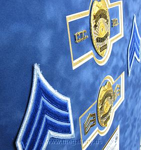 Police Department retirement shadow box with police badges, patches, ID cards and lapel pins (detail)

The Gallery at Brookwood
www.thegallery.us
770-941-3394
Your Custom Framing Expert
Picture Framing Examples
Custom Framing Examples
Shadowbox Examples