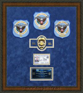 Police Department retirement shadow box with police badges, patches, ID cards and lapel pins.

The Gallery at Brookwood
www.thegallery.us
770-941-3394
Your Custom Framing Expert
Picture Framing Examples
Custom Framing Examples
Shadowbox Examples