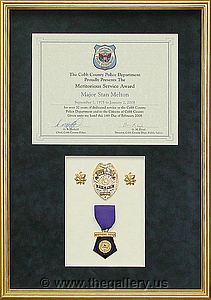 Cobb County Police Department retirement gift. We've done 100's for Cobb County Police Dept.

The Gallery at Brookwood
www.thegallery.us
770-941-3394
Your Custom Framing Expert
Picture Framing Examples
Custom Framing Examples
Shadowbox Examples