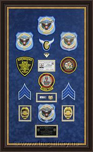 Police Department retirement shadow box with police badges, patches, ID cards and lapel pins.

The Gallery at Brookwood
www.thegallery.us
770-941-3394
Your Custom Framing Expert
Picture Framing Examples
Custom Framing Examples
Shadowbox Examples