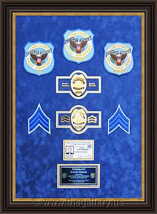 Cobb County Police Department retirement shadow box with police badges, patches, ID cards and lapel pins.

The Gallery at Brookwood
www.thegallery.us
770-941-3394
Your Custom Framing Expert
Picture Framing Examples
Custom Framing Examples
Shadowbox Examples