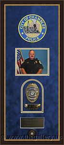 Cobb County Police Department retirement shadow box with police badges, patches, ID cards and lapel pins.

The Gallery at Brookwood
www.thegallery.us
770-941-3394
Your Custom Framing Expert
Picture Framing Examples
Custom Framing Examples
Shadowbox Examples
