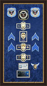 Cobb County Police Department retirement shadow box with police badges, patches, ID cards and lapel pins.

The Gallery at Brookwood
www.thegallery.us
770-941-3394
Your Custom Framing Expert
Picture Framing Examples
Custom Framing Examples
Shadowbox Examples