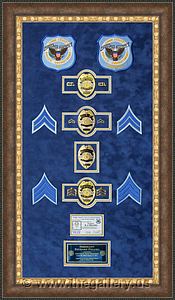 Cobb County Police Department retirement shadow box with police badges, patches, ID cards and lapel pins.

The Gallery at Brookwood
www.thegallery.us
770-941-3394
Your Custom Framing Expert
Picture Framing Examples
Custom Framing Examples
Shadowbox Examples