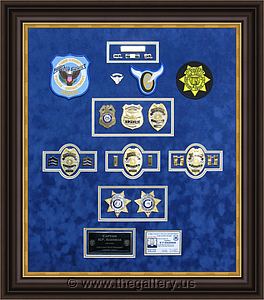 Cobb County Police Department retirement shadow box with police badges, patches, ID cards and lapel pins.

The Gallery at Brookwood
www.thegallery.us
770-941-3394
Your Custom Framing Expert
Picture Framing Examples
Custom Framing Examples
Shadowbox Examples