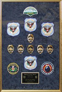 Police Department retirement shadow box with police badges, patches, ID cards and lapel pins.

The Gallery at Brookwood
www.thegallery.us
770-941-3394
Your Custom Framing Expert
Picture Framing Examples
Custom Framing Examples
Shadowbox Examples
