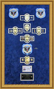 Cobb County Police Department retirement shadow box with police badges, patches, ID cards and lapel pins.

The Gallery at Brookwood
www.thegallery.us
770-941-3394
Your Custom Framing Expert
Picture Framing Examples
Custom Framing Examples
Shadowbox Examples