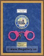  Police Department retirement shadow box with handcuffs, patches, ID cards and lapel pins.
office_art_framing.jpg